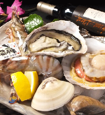 お料理：旬の魚貝盛り合わせ お酒：フランス産白ワインの「シャトー・モンペラ」